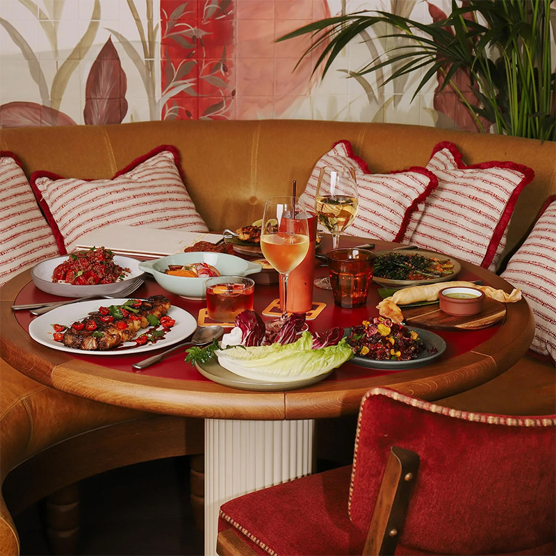 A booth at Tope Brussels with decorative cacti around it.