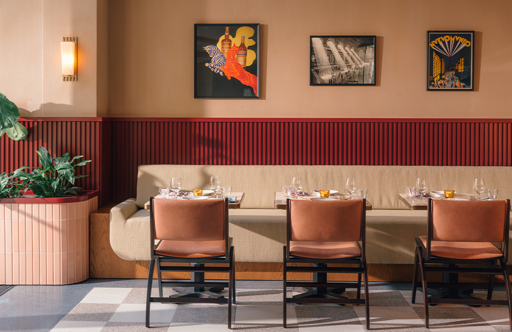 Spaced out clusters of round tables with chair.